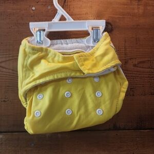 Baby city cloth diaper- yellow velcro and snaps with insert.